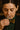 Woman smelling a glass of mezcl with a blurred background